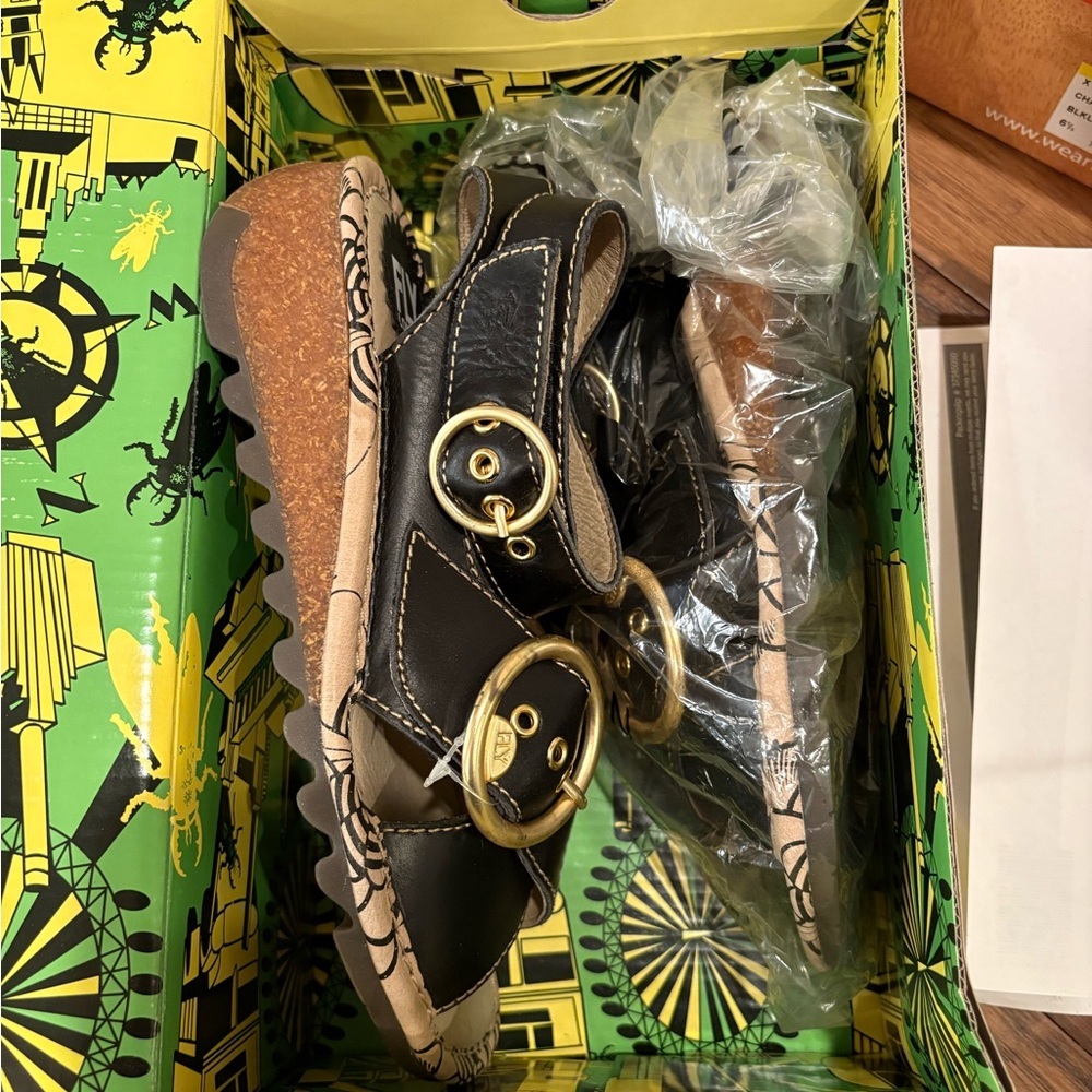 Black leather gold buckle sandals